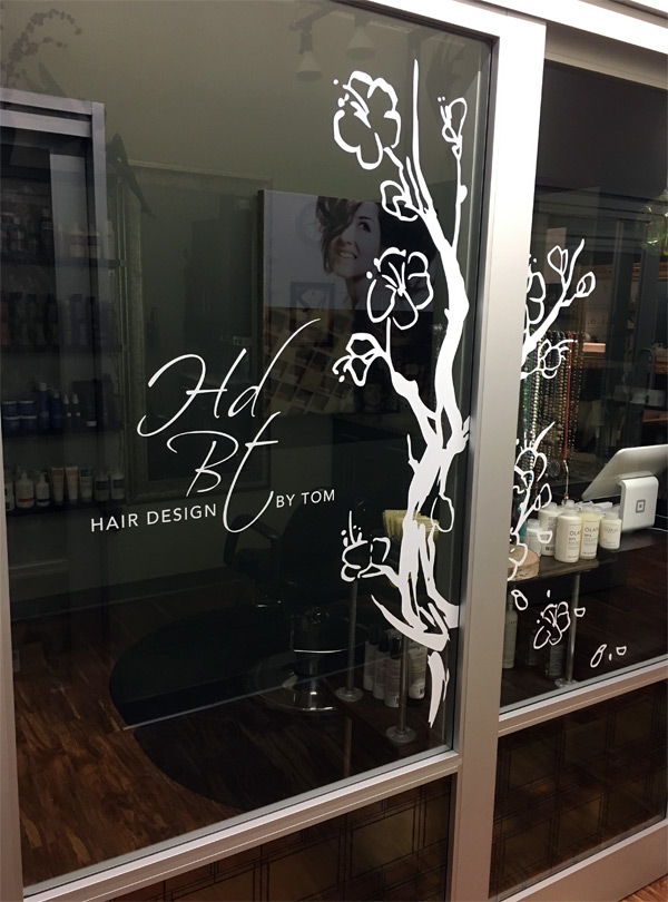 Hair Design By Tom salon entrance with logo