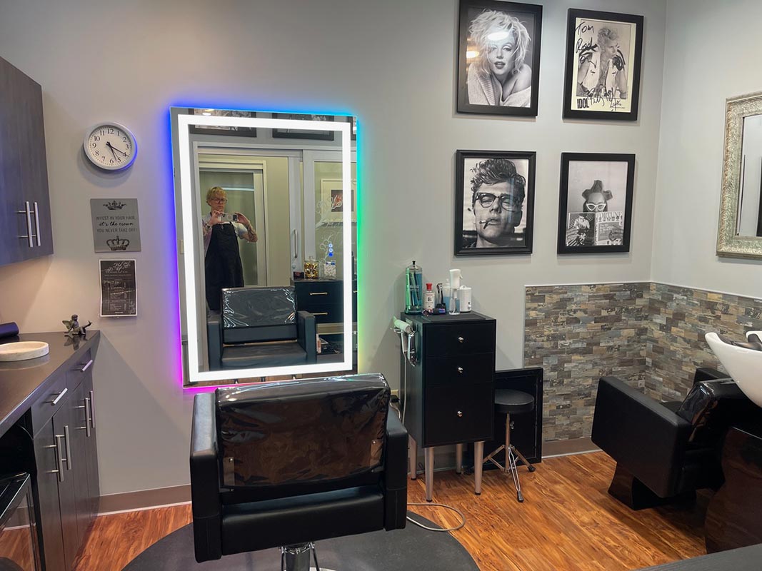 Hair Design By Tom salon interior with chair and mirror